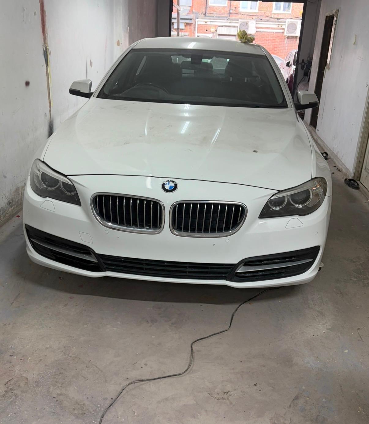 White BMW 5 Series fully restored after front-end collision repair